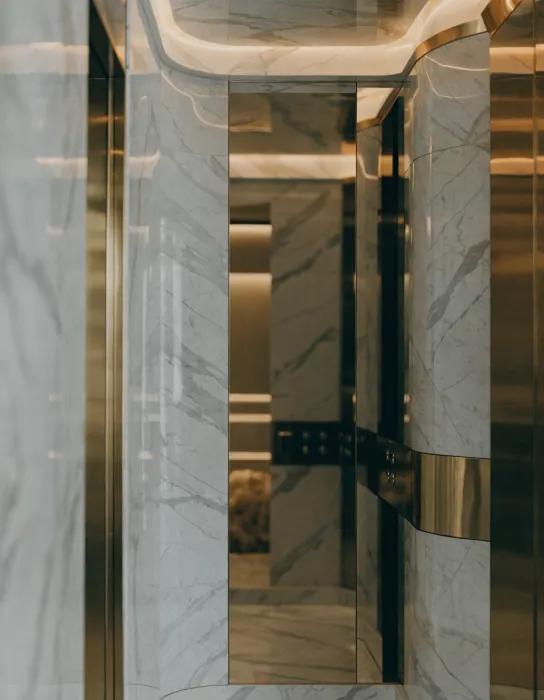 Villa lift cabin with marble and mirror finish