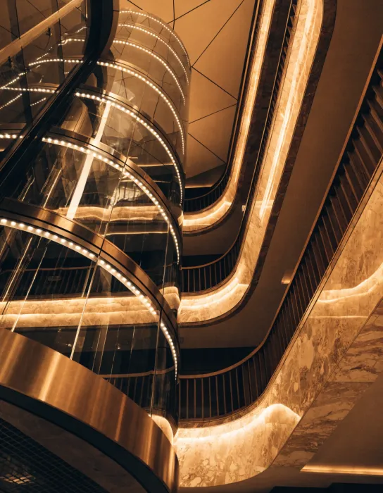 Half-round panoramic glass elevator in a hotel atrium